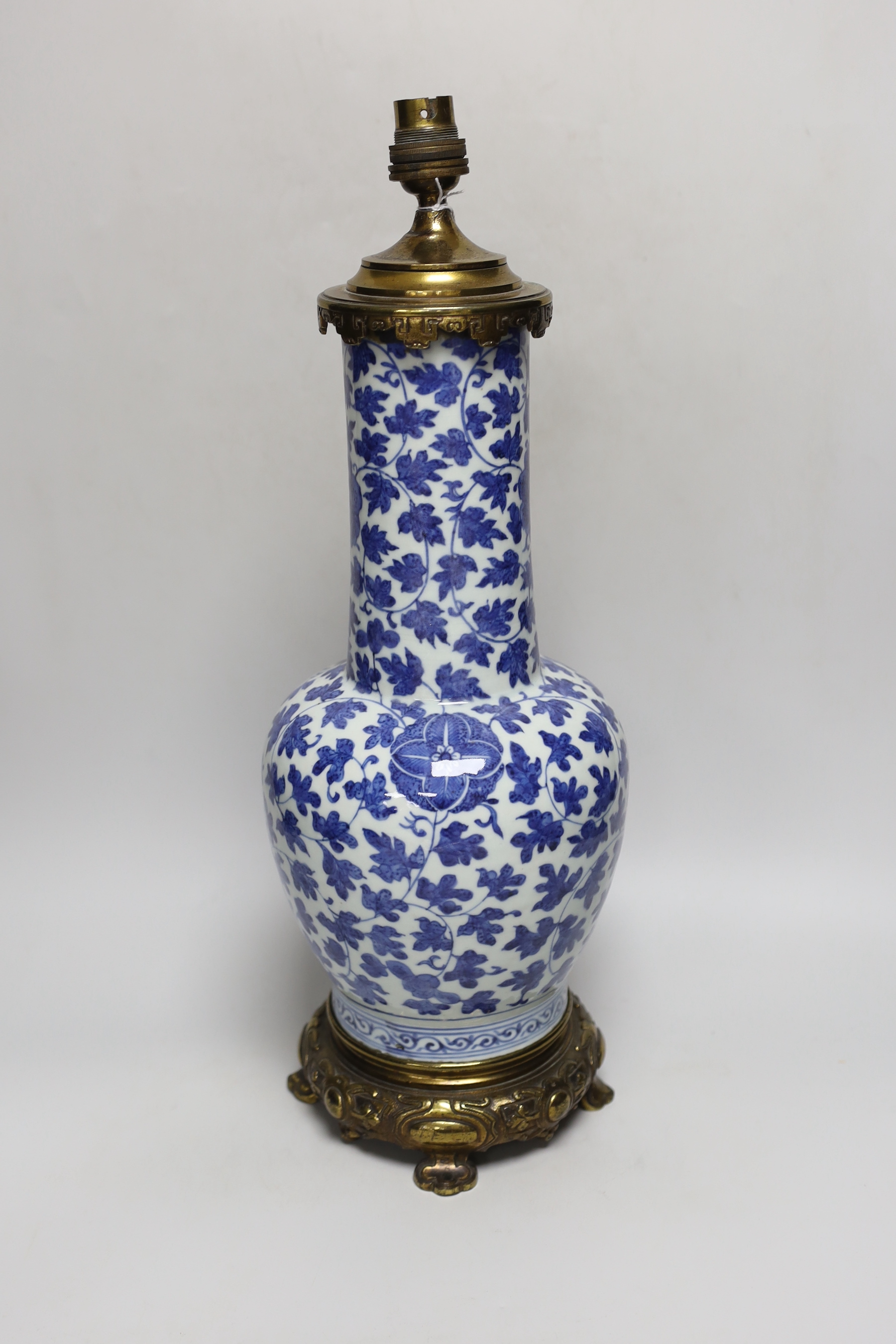 A 19th century Chinese blue and white ‘lotus’ vase, later converted into a brass lamp